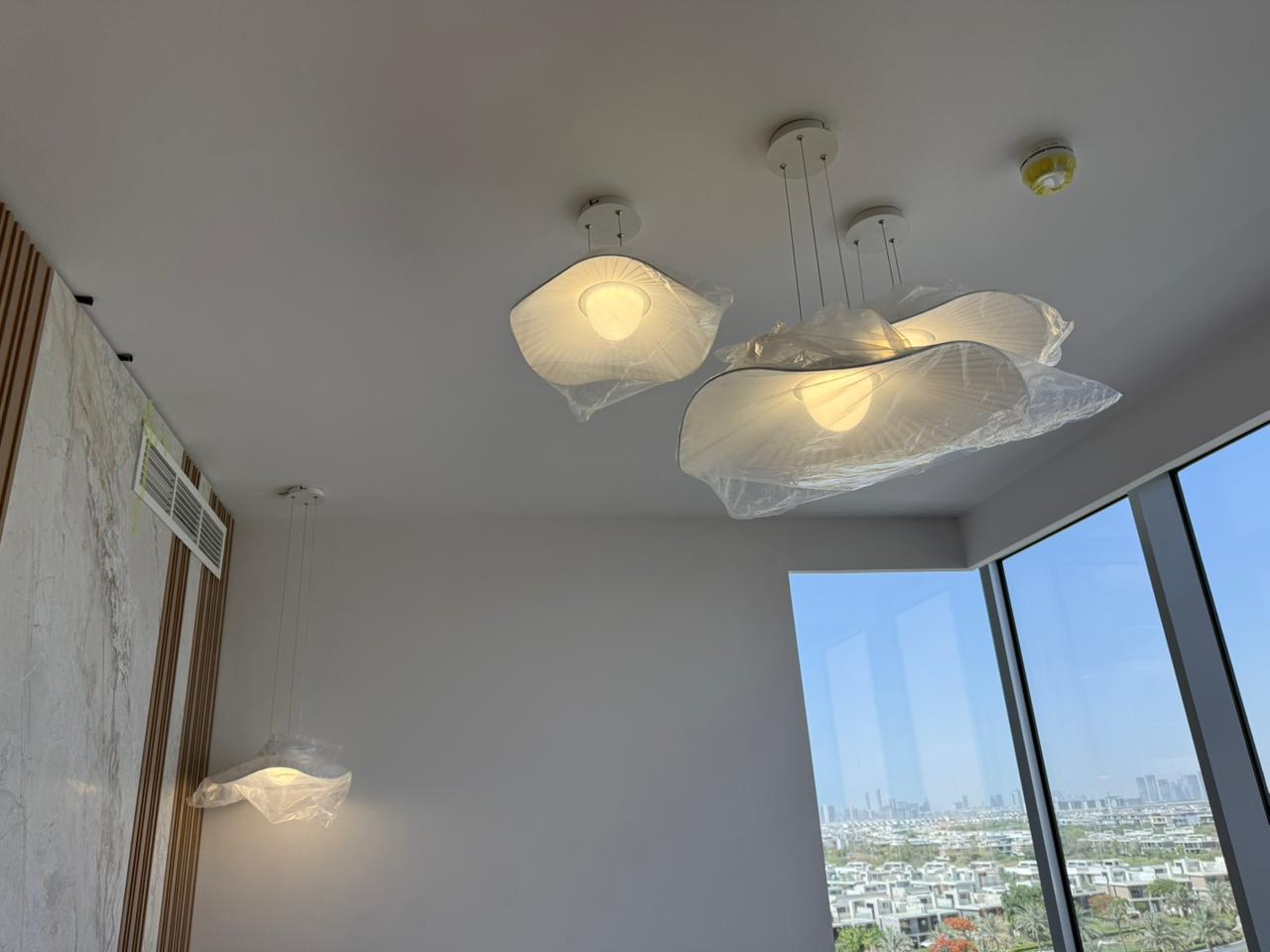 Professional chandelier installation process by certified technician in UAE