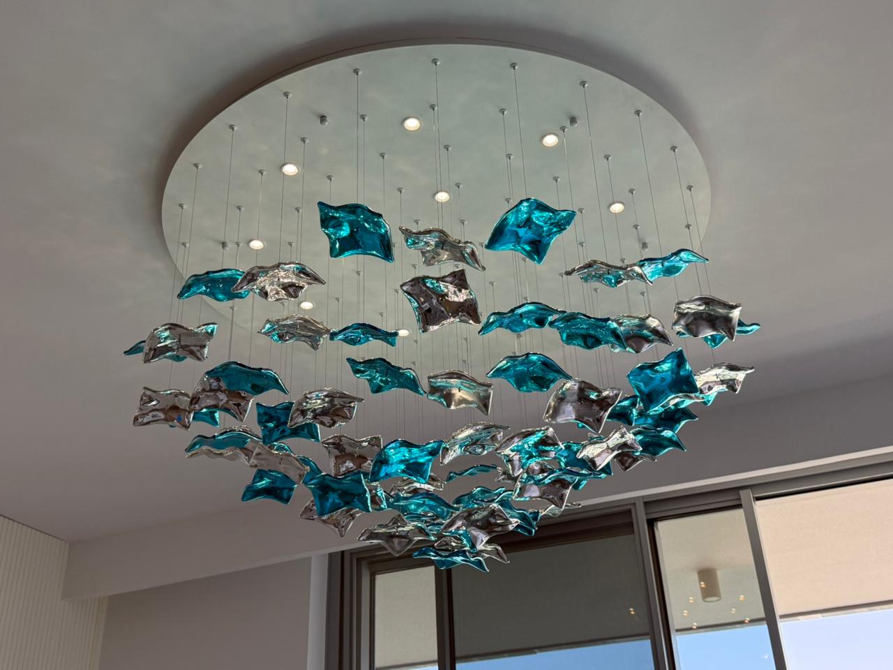 Elegant chandelier installation in luxury Dubai interior