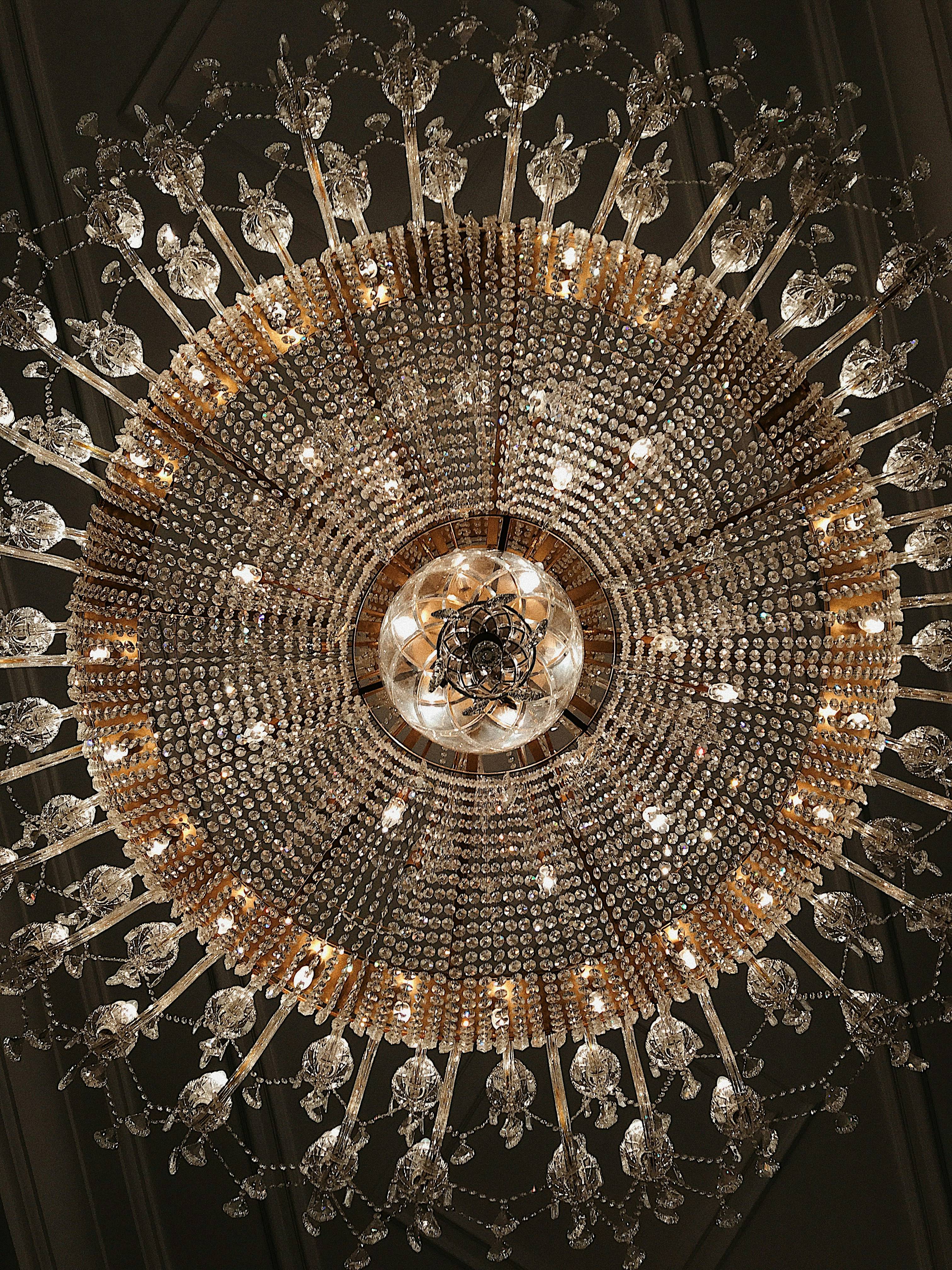 Intricate crystal chandelier professionally installed from below in Dubai