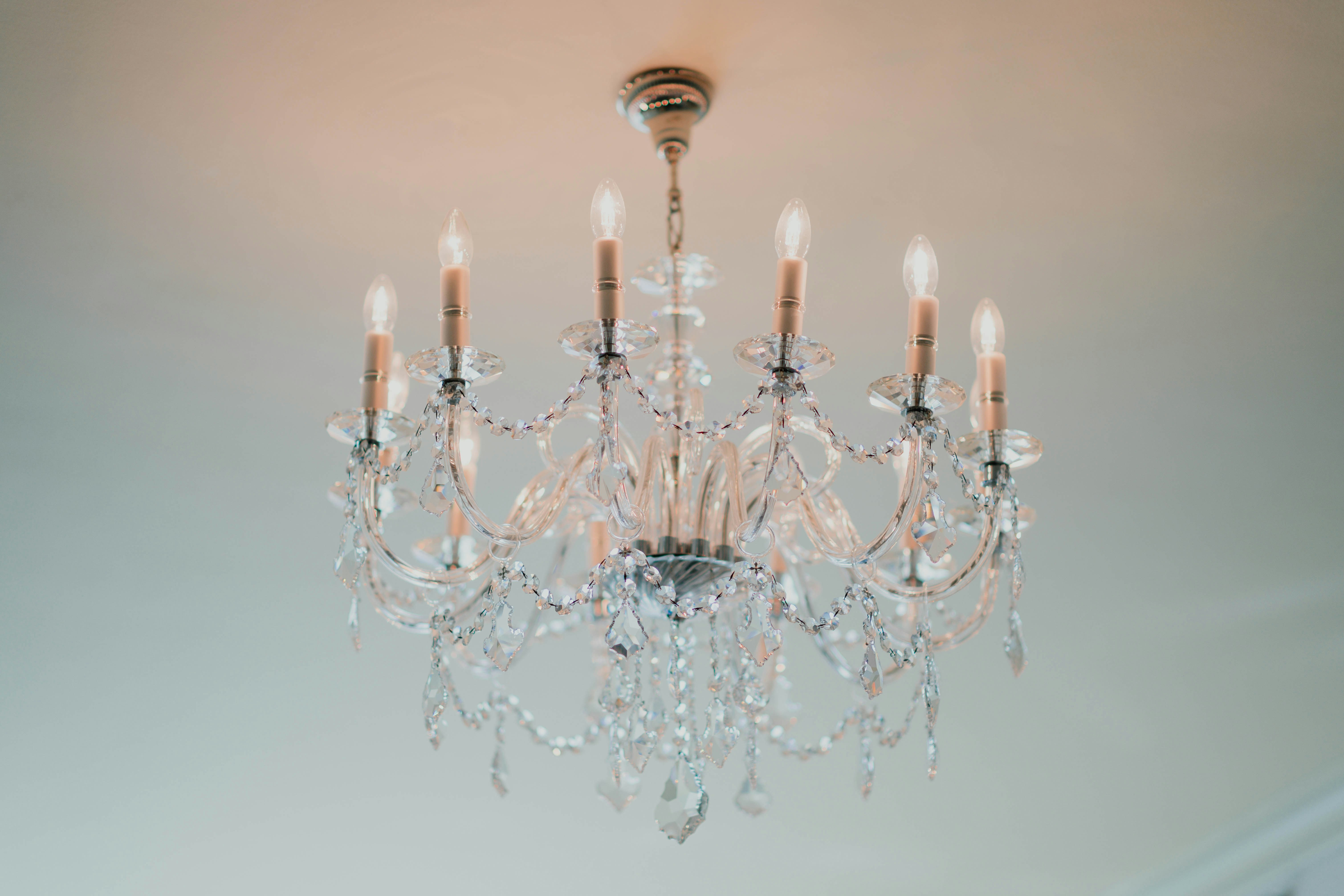 Classic crystal chandelier with candle-style bulbs installed in Dubai villa