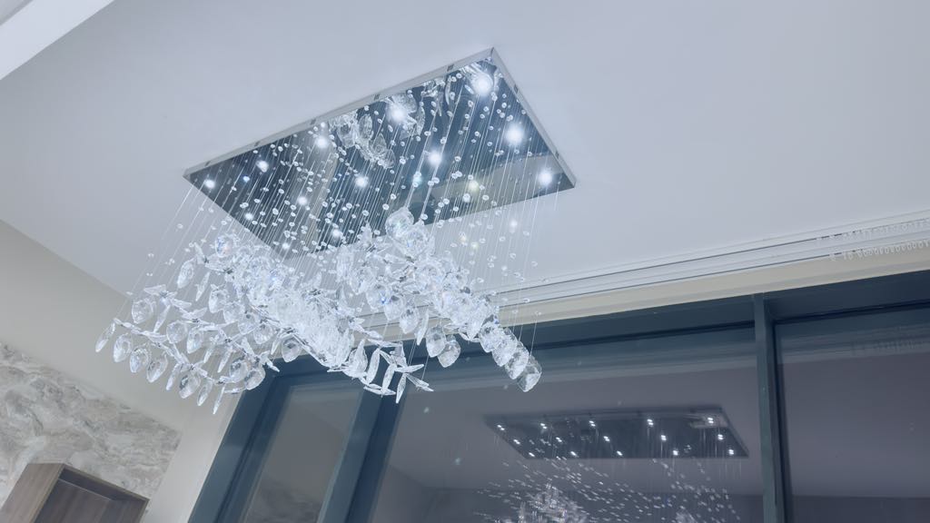 Rectangular cascading crystal chandelier creating luxurious atmosphere
